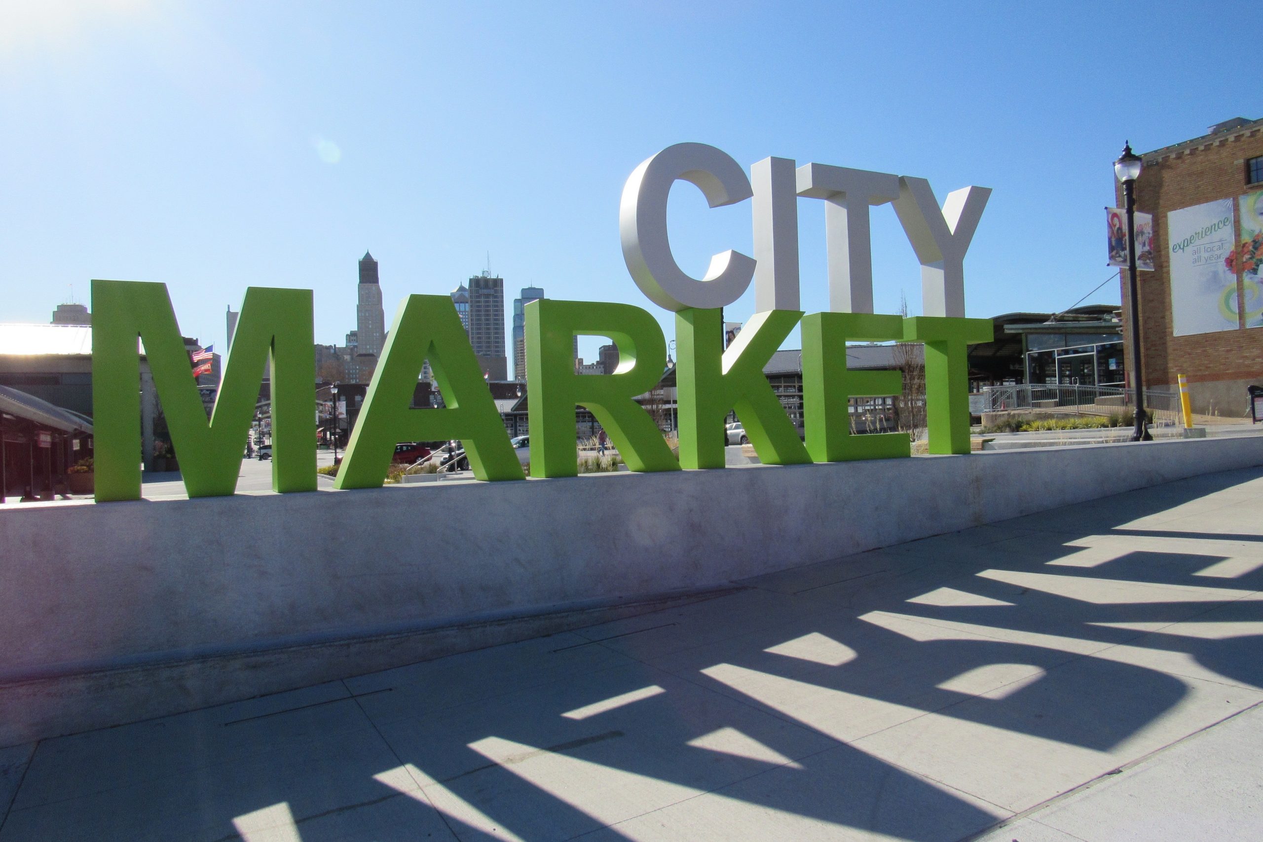 City market sign at the River Market in Kansas City with shadows