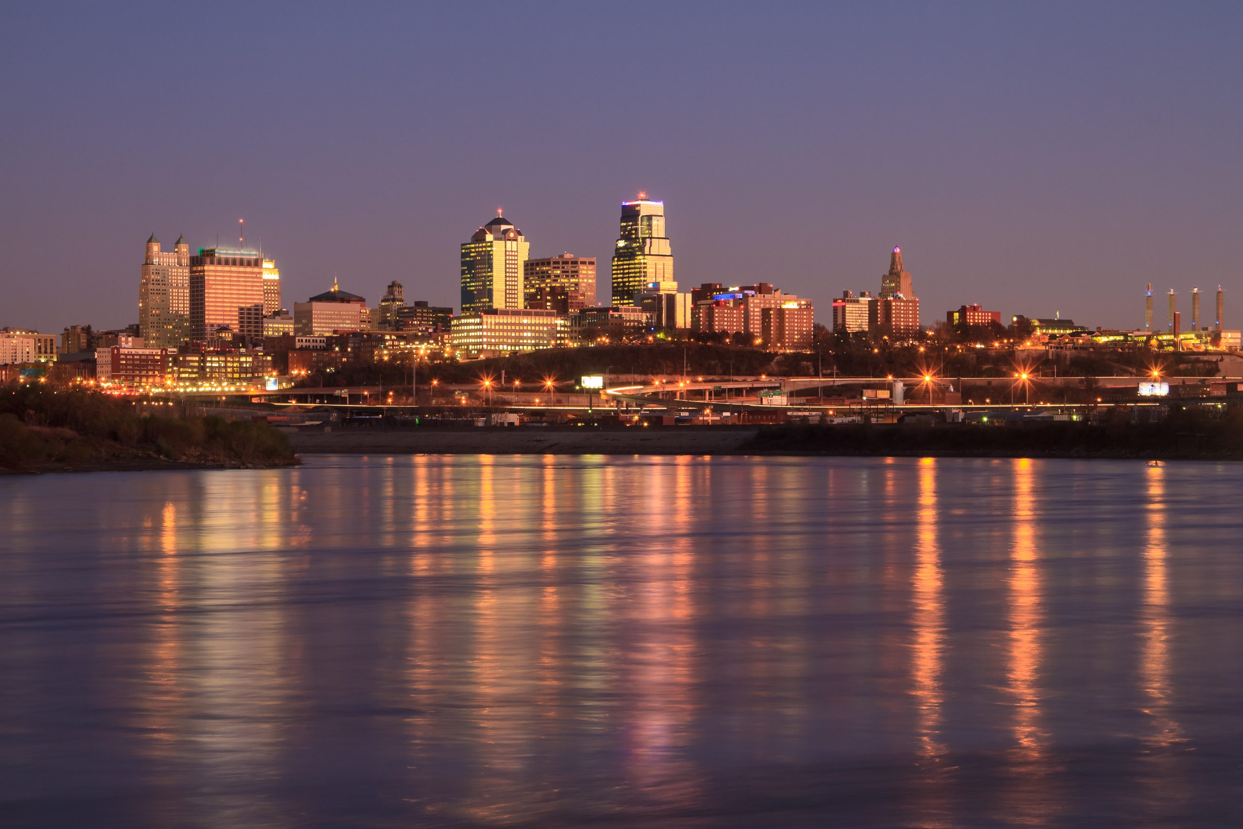 A view of the Kansas City skyline across the Missouri River downtown during Twilight