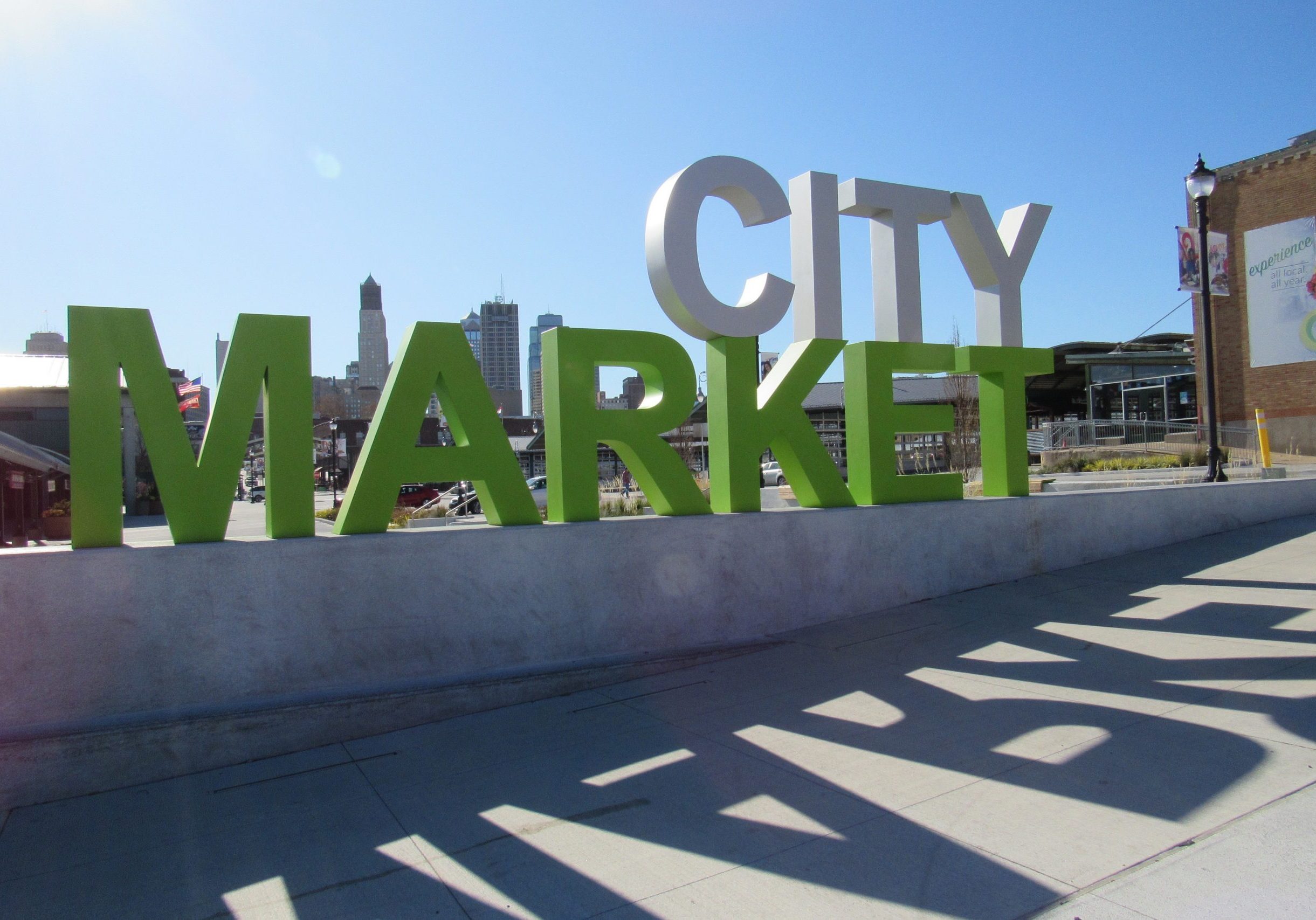City market sign at the River Market in Kansas City with shadows